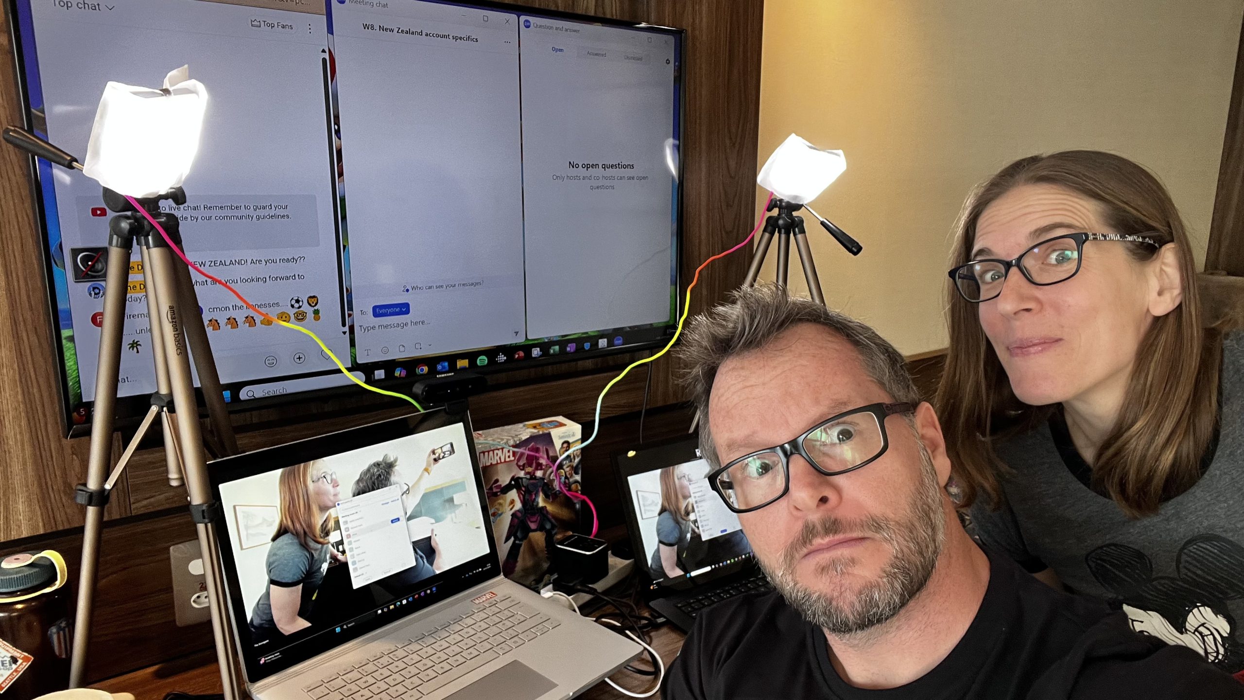 Running Rebel Finance School 2025 virtually from a hotel in Brazil with professional lighting, laptops, and screens set up for an online financial education workshop.