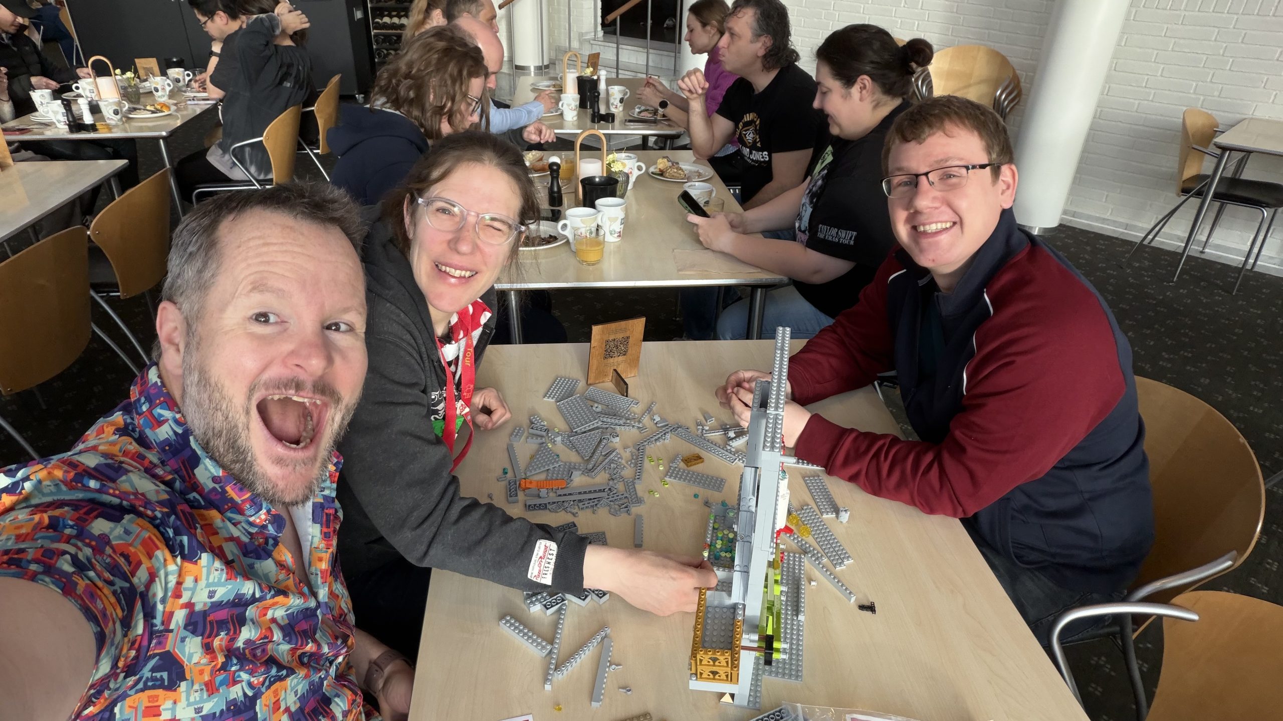 Alan and Katie Donegan building the Rocket to Financial Freedom LEGO model with Andrew at breakfast in Billund