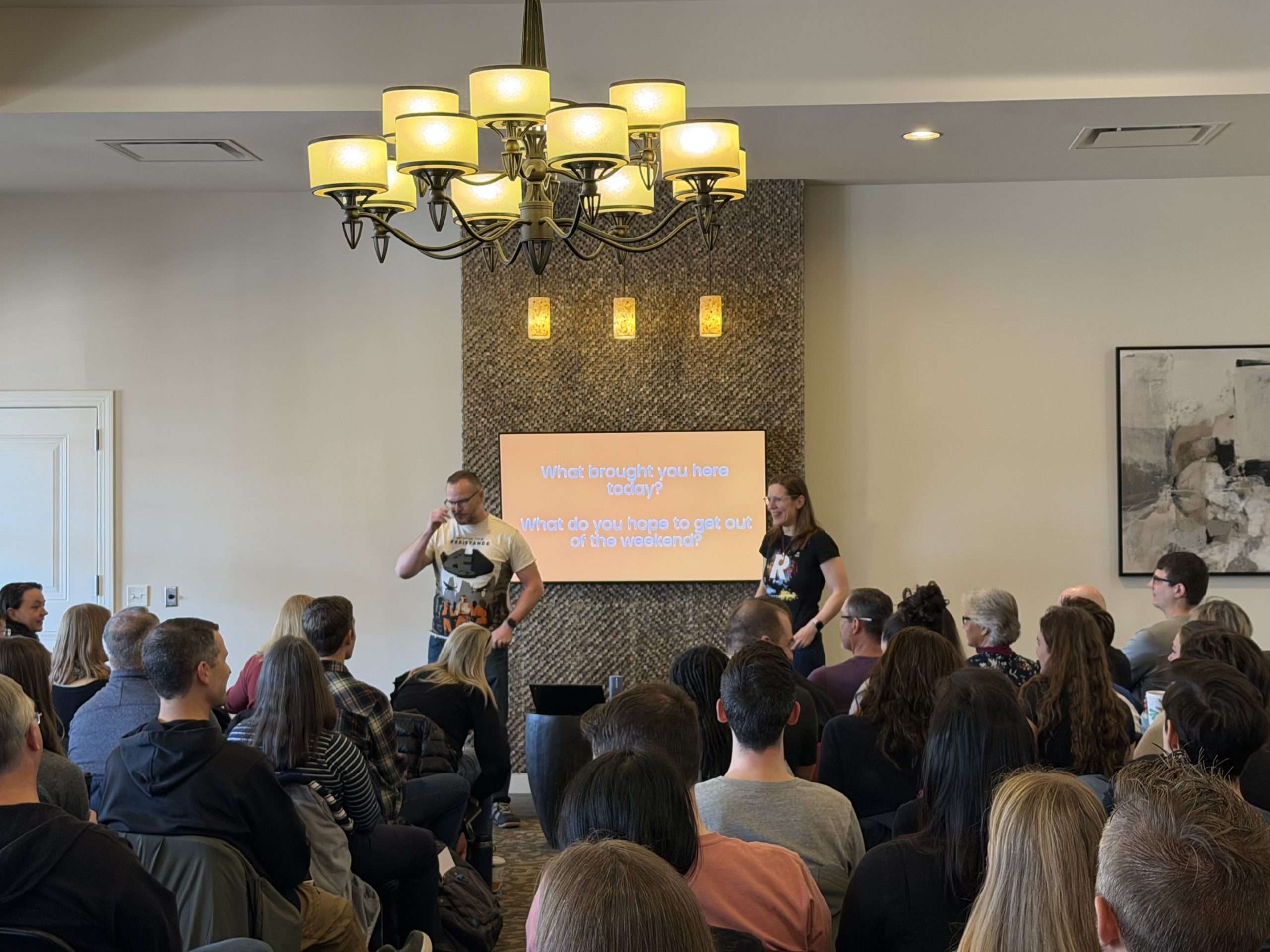Two presenters speak to a seated audience during an Extraordinary Richmond workshop