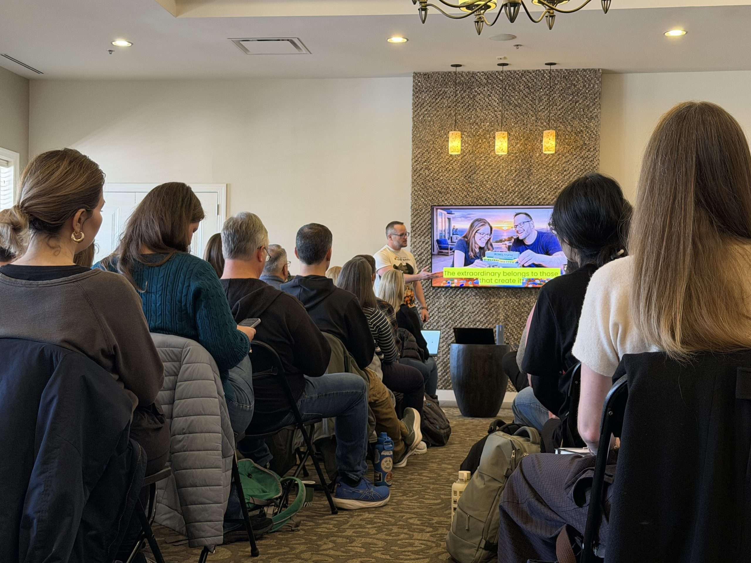 Attendees face a presenter and screen during an Extraordinary Richmond workshop